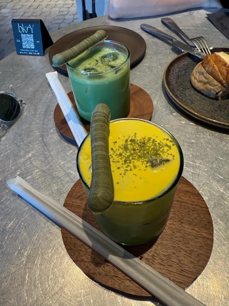Flaky sourdough croissants and a matcha latte on a marble counter at BKRY, Alserkal Avenue, Al Quoz, Dubai