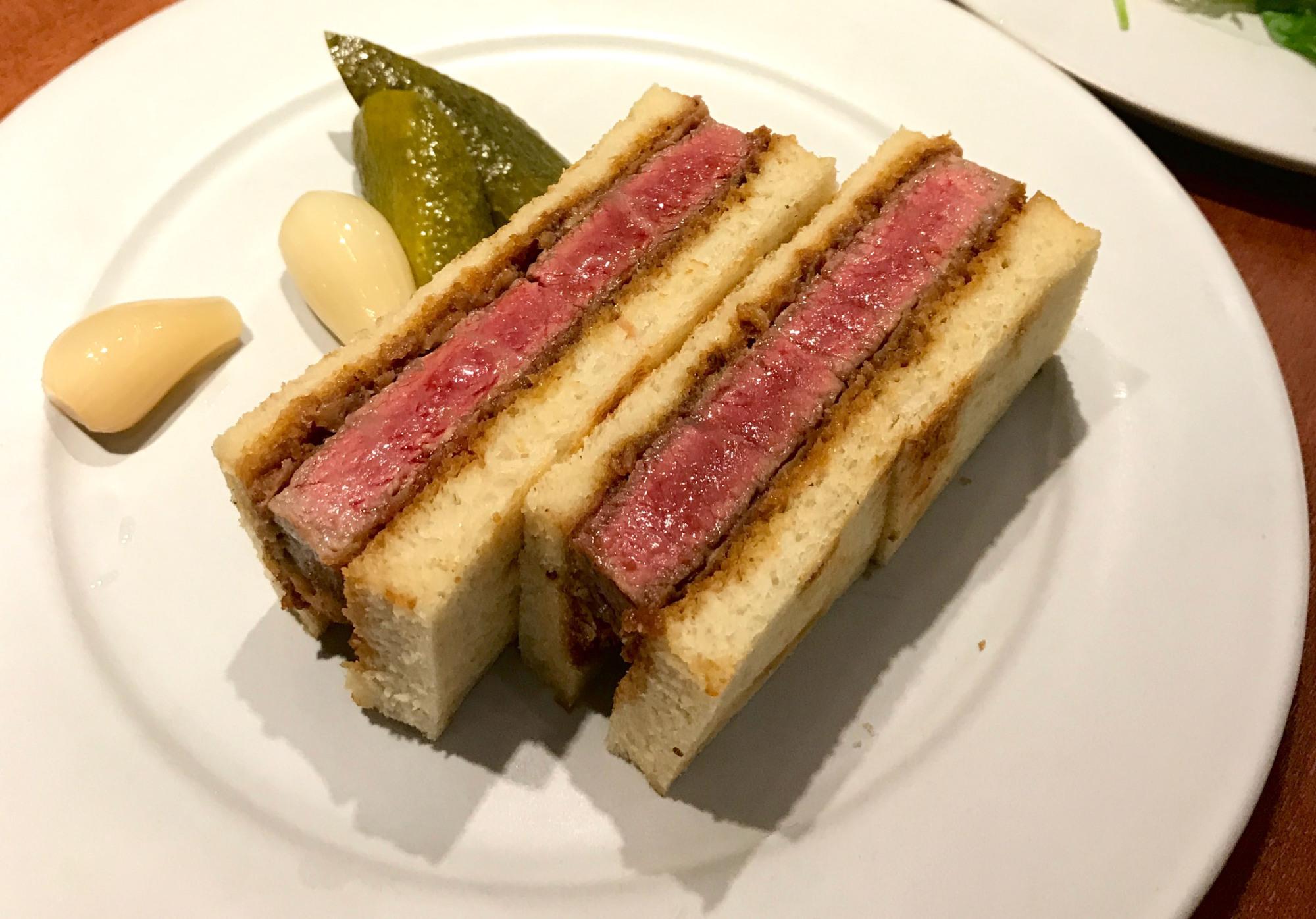 Wagyu katsu sando sliced to show perfectly marbled beef inside at Wagyumafia Nakameguro Tokyo