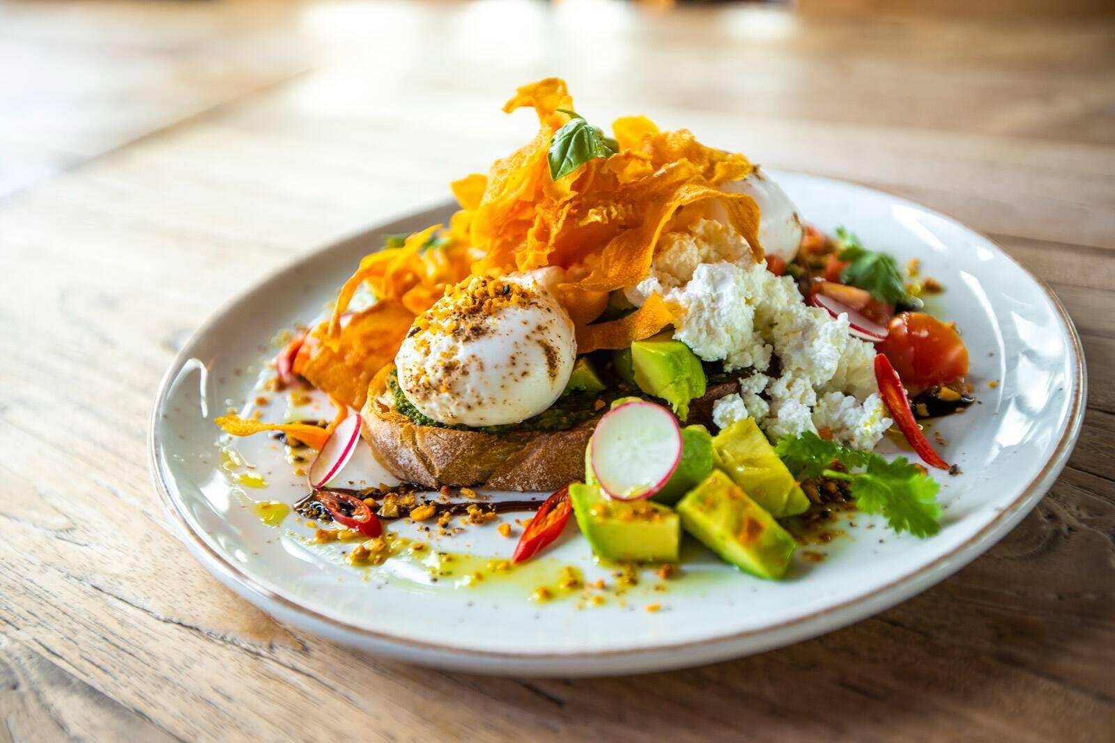 Poached eggs breakfast at Stomping Grounds café in Jumeirah 1 Dubai