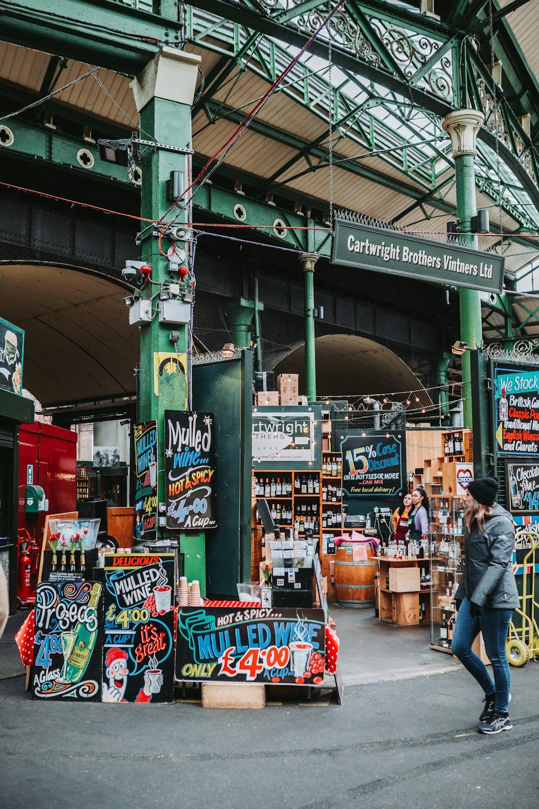 Cartwright Brothers Vintners stall at Borough Market London with colorful mulled wine chalkboard signs