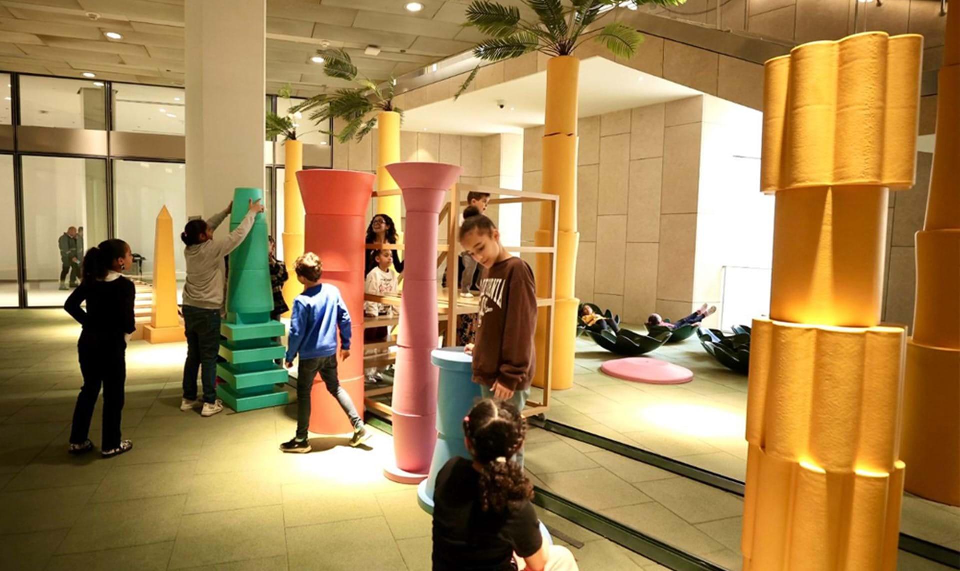 Children engaging with interactive exhibits at the GEM Children's Museum