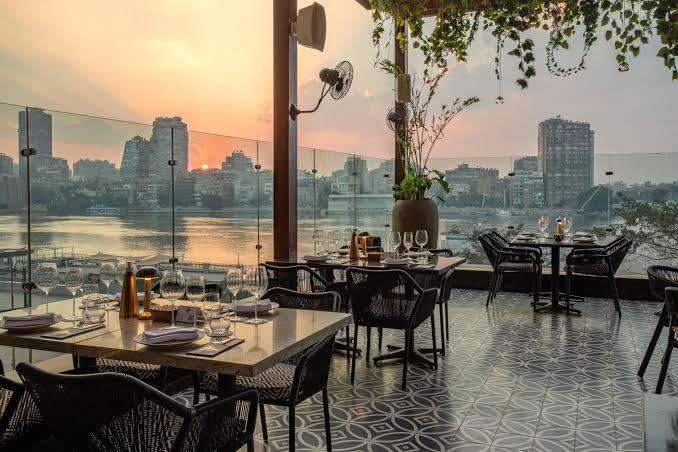 Gingko restaurant terrace at Fairmont Nile City with Nile view and greenery ceiling