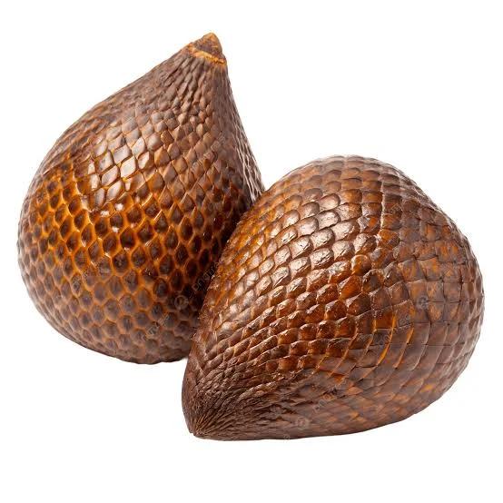 Close-up of deep red salak snake fruit clusters showing bumpy textured skin on the palm in Sibetan Village, Bali