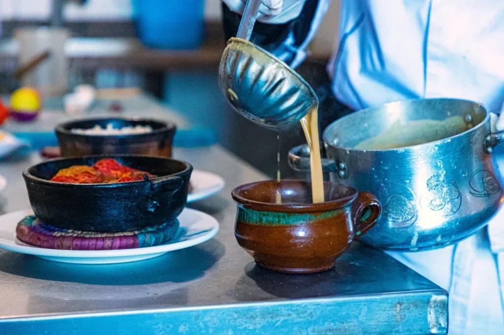 Traditional Egyptian molokhia served with rice and grilled meat.