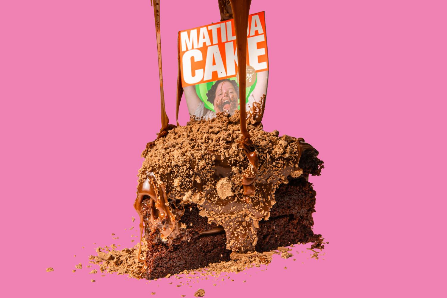 Parker’s Matilda Cake, a rich chocolate sponge cake topped with crunchy chocolate flakes and chocolate sauce.