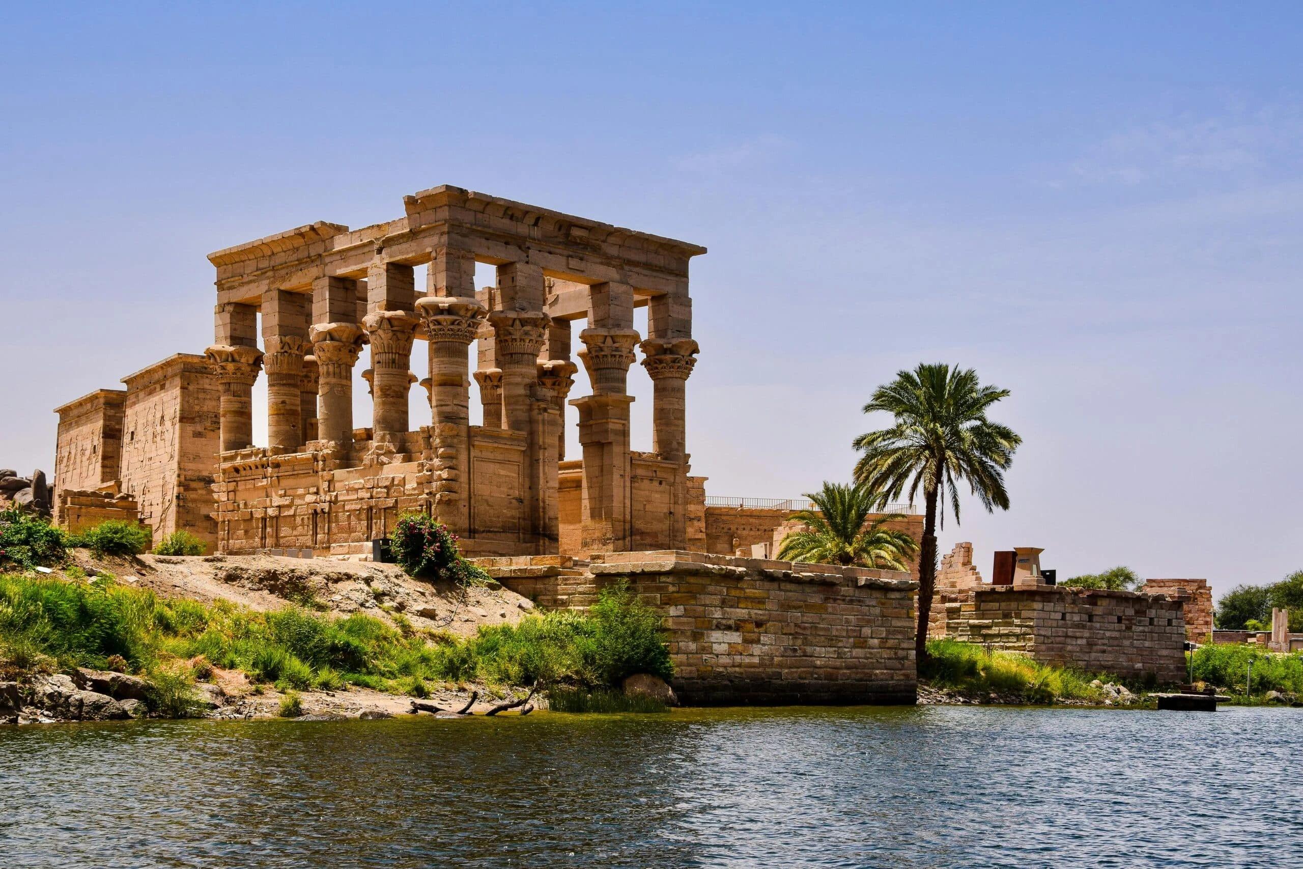 Philae Temple complex rising from Agilkia Island on the Nile at dusk